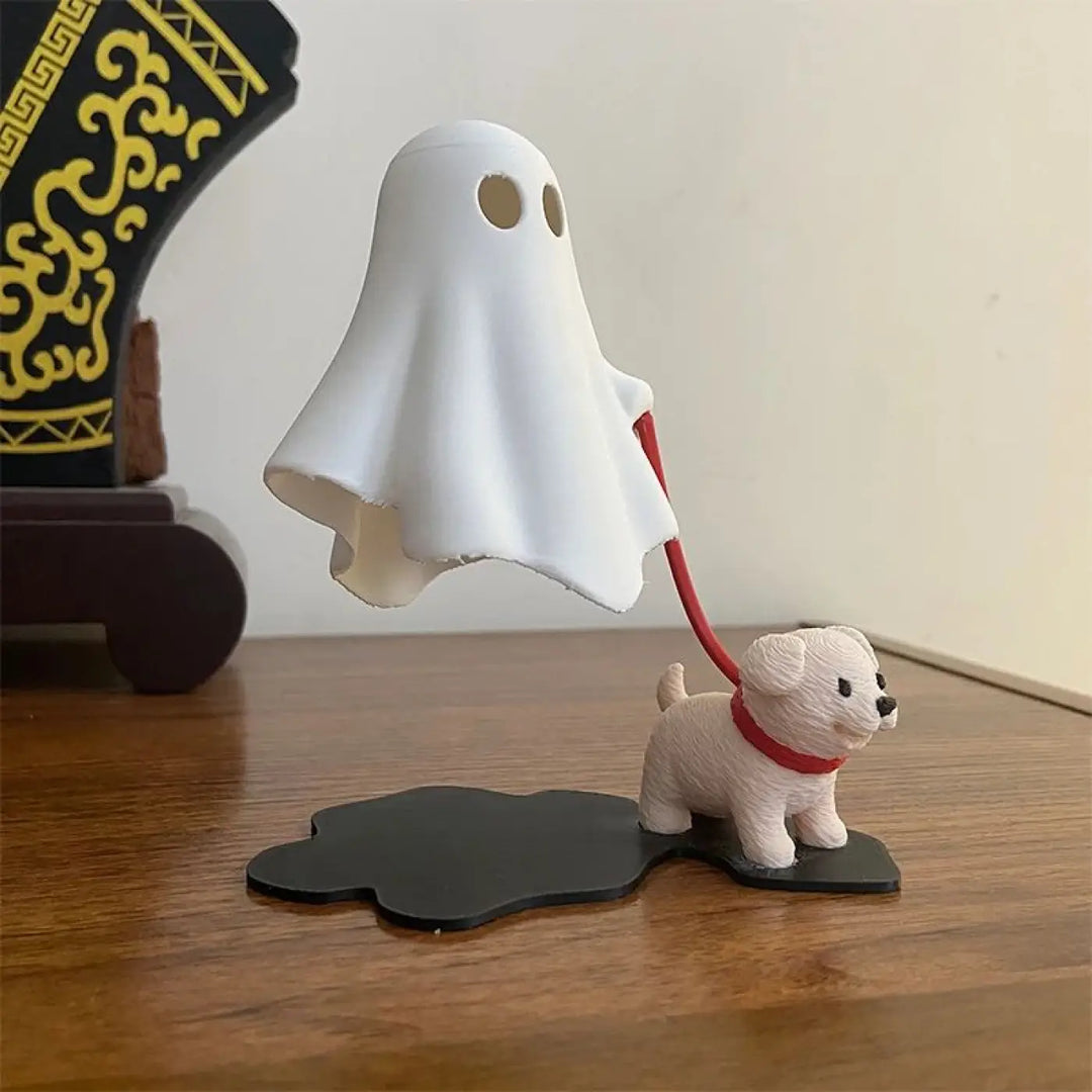 Veilleuse boofi figurine fantôme blanche avec deux trous pour les yeux tenant une laisse rouge attachée à un chien blanc