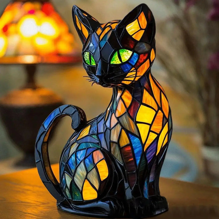 Veilleuse féline en verre coloré avec yeux verts lumineux et segments orange jaune bleu violet, lampe chat décorative bastet