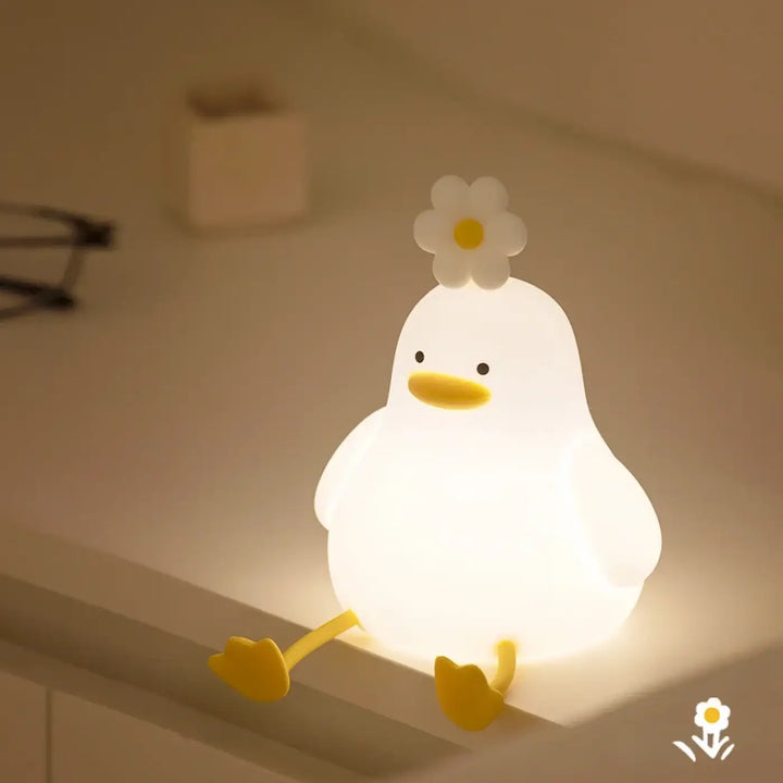 Veilleuse daffy en forme de canard blanc doux avec lumière douce pour chambre d’enfant, bec et pieds jaunes, fleur dessus