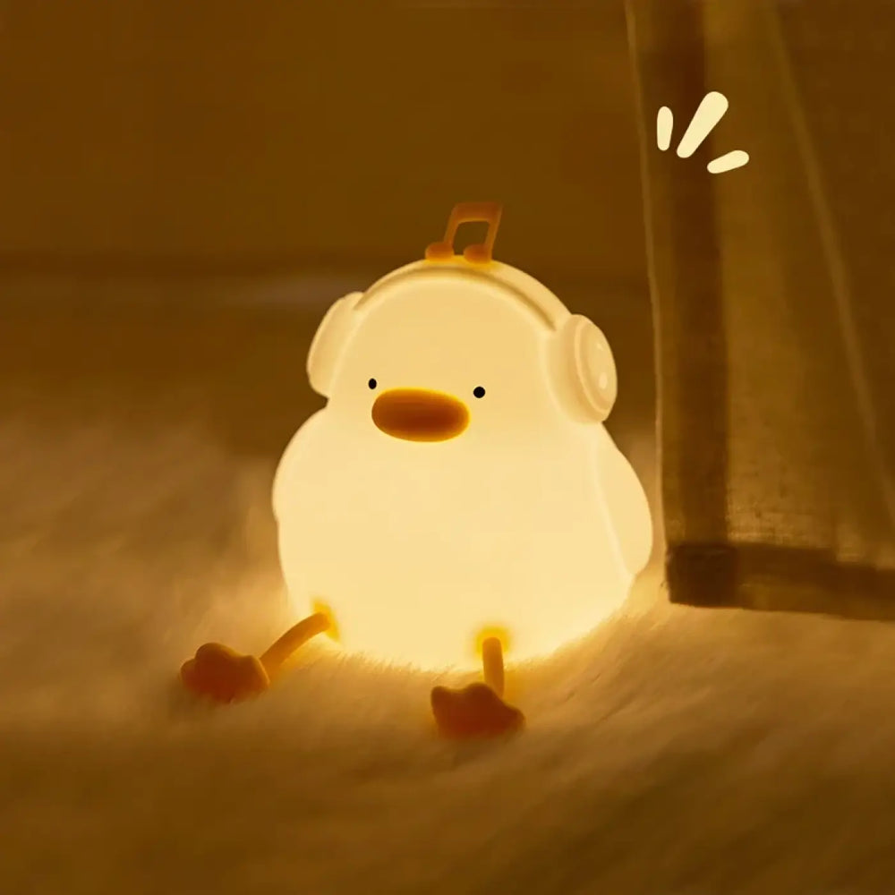 Veilleuse canard daffy lumière douce blanche avec bec et pieds orange et casque pour chambre d’enfant
