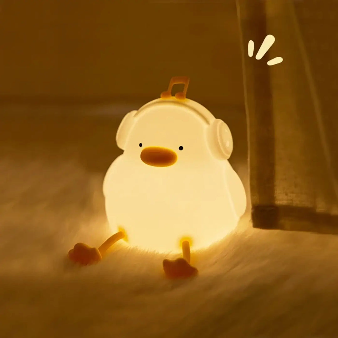 Veilleuse canard daffy lumière douce blanche avec bec et pieds orange et casque pour chambre d’enfant
