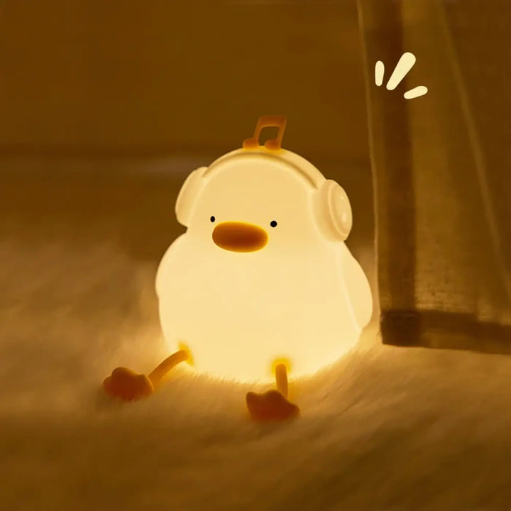 Veilleuse canard daffy lumière douce blanche avec bec et pieds orange et casque pour chambre d’enfant