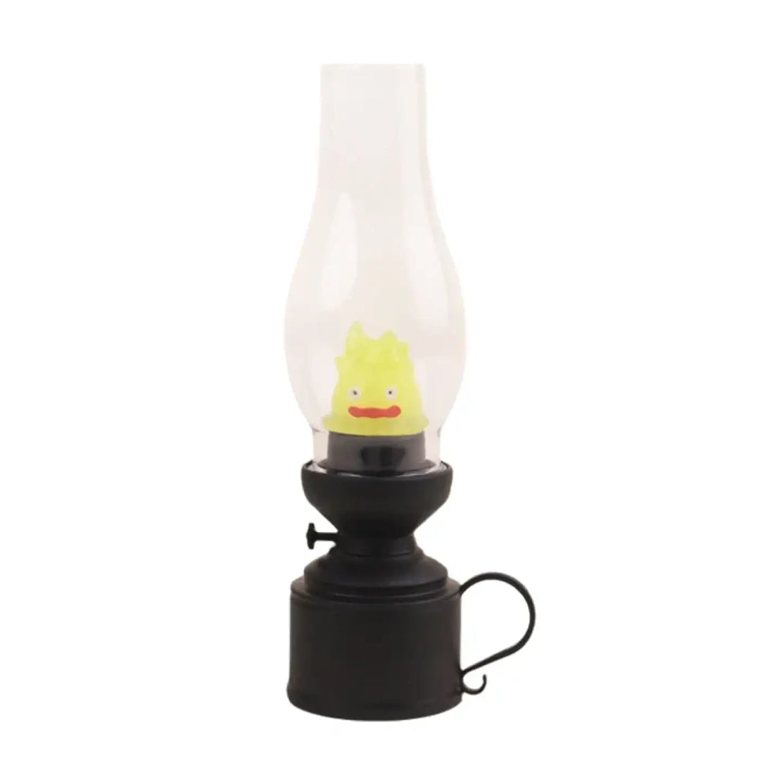 Veilleuse hallo en métal noir avec cheminée en verre clair et figurine jaune souriante pour décoration intérieure effet flamme veilleuse led effet