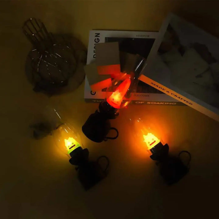 Veilleuse hallo avec trois bougies led effet flamme lumineuses, bases noires et supports en verre clair pour décoration intérieure