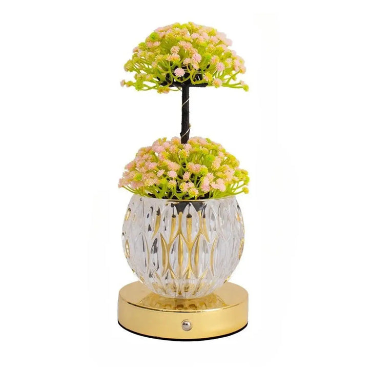 Lampe de table tulyna avec corps en verre facetté clair, garniture dorée, fleurs artificielles roses et vertes, source de lumière