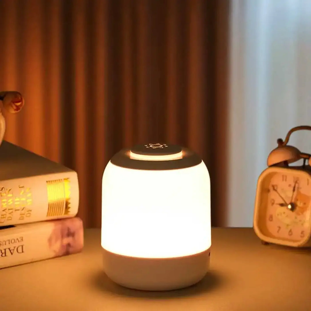 Veilleuse lumineuse lumina cylindrique blanche avec top noir, icône soleil et douce devient pour réveils nocturnes