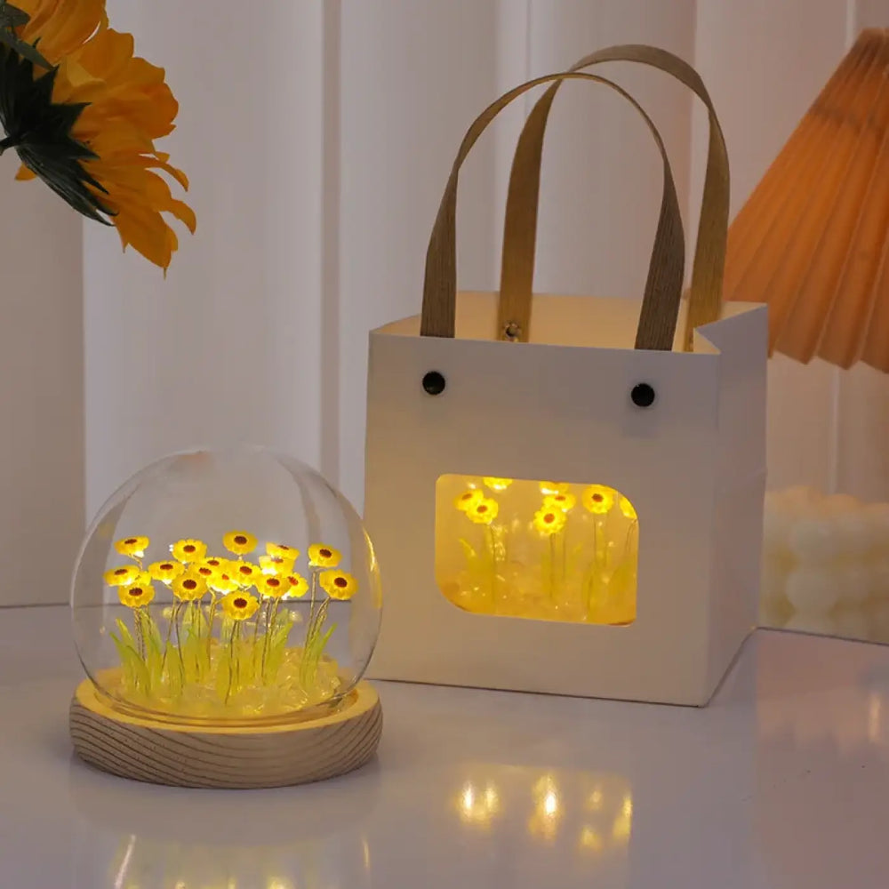 Veilleuse helios avec tournesol décorative jaune lumineux en verre transparent sur socle en bois